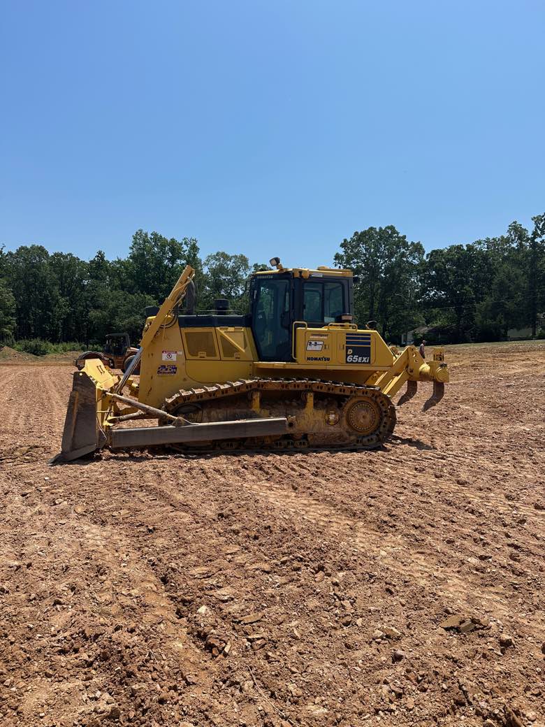 Komatsu D65EXi intelligent machine control dozer on a freshly graded pad